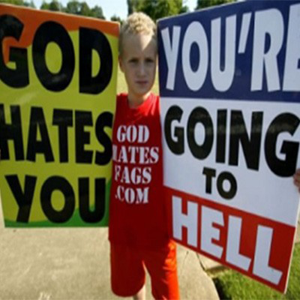 Photo of a Child holding homophobic banners