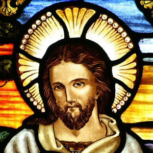 an image of Jesus on a stained glass window